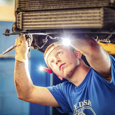 Mechanic working on a car.